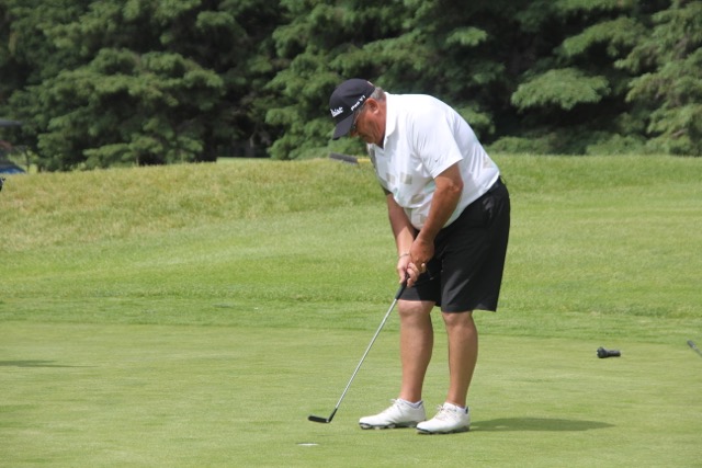 Garth Collings taps in on 18 for the win.